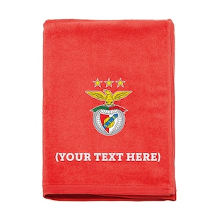 May include: Red fleece blanket featuring the Sporting Clube de Portugal crest and the text "(YOUR TEXT HERE)"