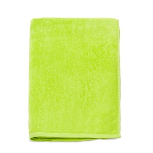 May include: A bright green bath towel made of soft terry cloth.