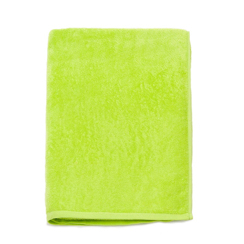 May include: A bright green bath towel made of soft terry cloth.