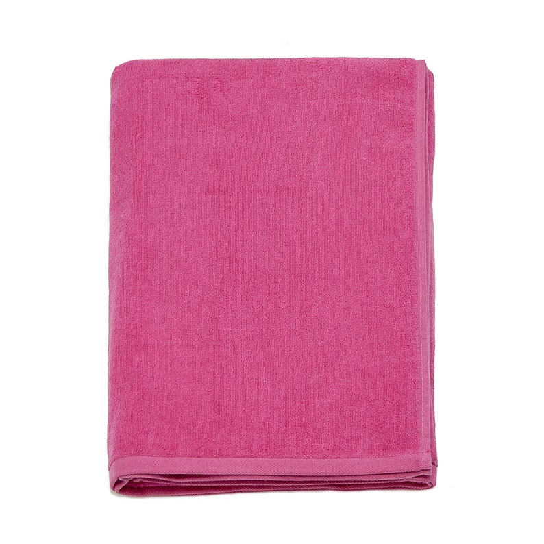 May include: A folded pink bath towel. The towel is made of a soft, absorbent material.