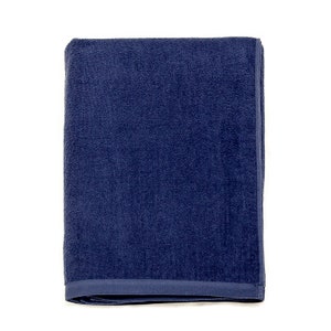 May include: A dark blue bath towel folded in half. The towel is made of a soft, absorbent material.