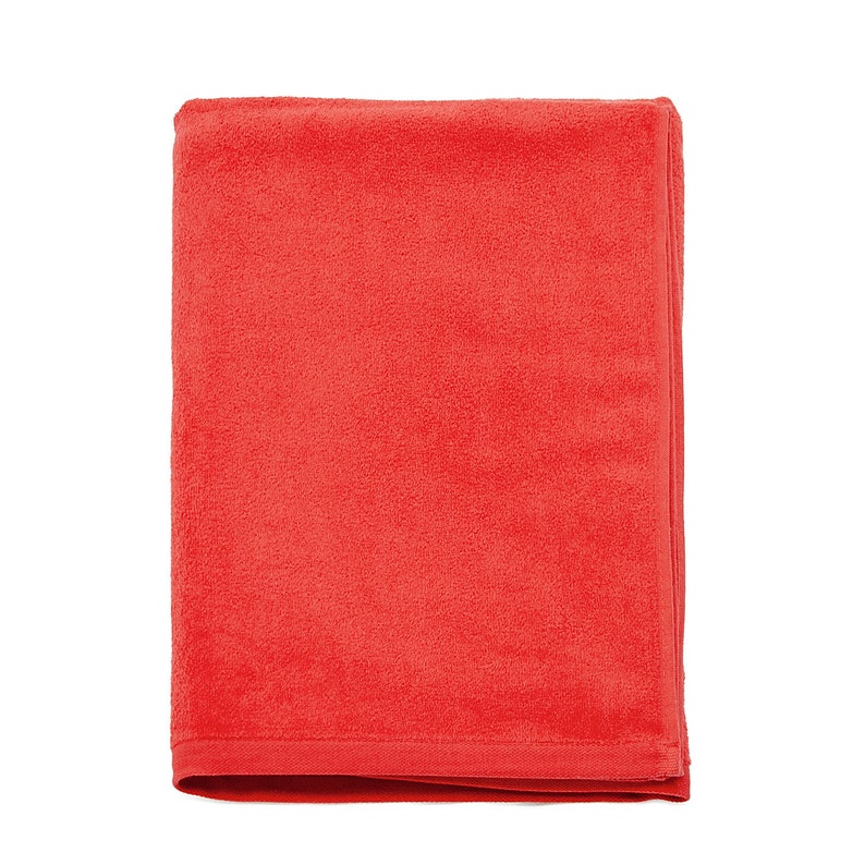 May include: A red fleece blanket folded in half. The blanket is soft and plush.