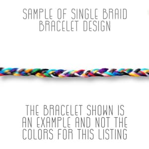 May include: A close-up of a multi-colored braided bracelet. The bracelet is made of several strands of colorful thread woven together. The text "SAMPLE OF SINGLE BRAID BRACELET DESIGN" is at the top of the image. The text "THE BRACELET SHOWN IS AN EXAMPLE AND NOT THE COLORS FOR THIS LISTING" is at the bottom of the image.