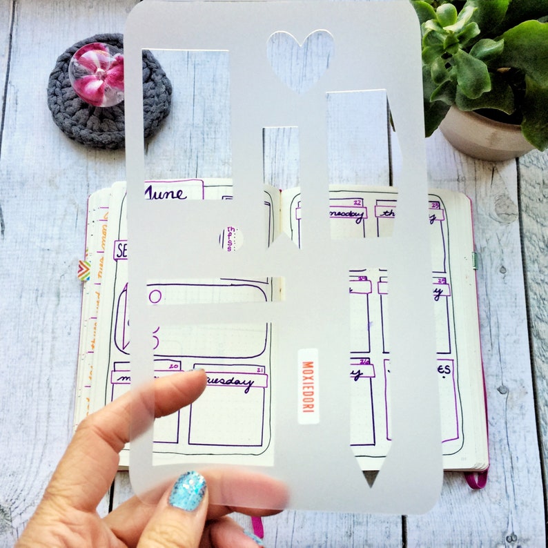 Weekly Bullet Journaling Stencil makes a fast and easy weekly layout in your bujo. Grab it over here. image 1