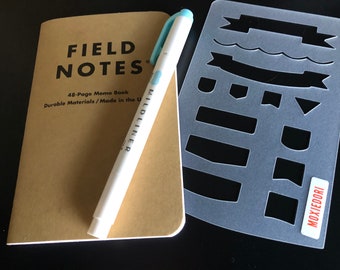 FIELD NOTES Banner Stencil quickly produces banners, flags and tasks to-do lists. Available over here.