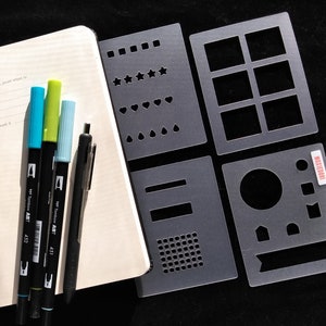 4 Piece Essential bullet journaling mini stencil set makes monthly, tracker, weekly and daily layout elements quickly. Get it here.