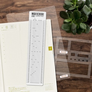 A5 Hobonichi Stencil, Ruler, and Pencil Board Bundle for the Techo make journaling easier and faster. Get the bundle here.