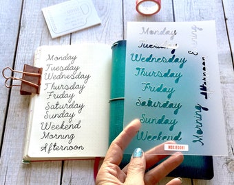 Cursive Days of the Week bullet journaling stencil quickly adds calligraphy flair to your bujo spread. Hop over here to get it.