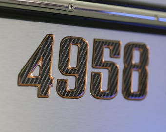 Pegatinas de registro de embarcaciones con números abovedados de fibra de carbono y borde de bronce