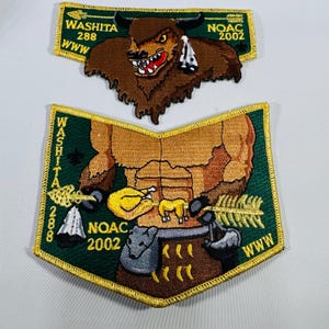 May include: Two embroidered patches with a green border and gold stitching. The top patch features a brown bison with a red mouth and the text "WASHITA 288" and "NOAC 2002". The bottom patch has a muscular figure holding a bow and arrow.