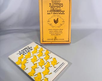 May include: Two vintage books on a light gray surface. The first book, "The Homesteader's Handbook to Raising Small Livestock," is yellow with black text and a chicken illustration. The second book, "The Family Poultry Flock," has a white cover with yellow chick illustrations.