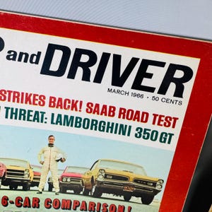 May include: A retro "Car and Driver" magazine cover from March 1966. The cover shows a yellow car, a man in a racing suit, and the headline "Strikes Back! Saab Road Test". The magazine's price is 50 cents.