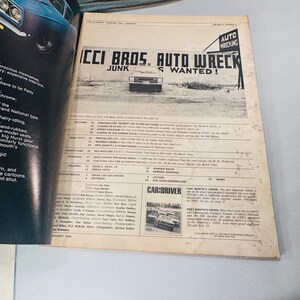 May include: A vintage Car and Driver magazine open to a page with a black and white image of a car and the headline "ICCI BROS. AUTO WRECK JUNK S WANTED!". The magazine is dated February 1966.