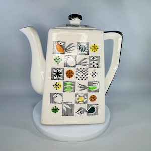 May include: A white ceramic mug with a black handle and the text "But First, Coffee" in a black, bold font. The mug is likely 4 inches tall and holds approximately 12 ounces of liquid. Perfect for enjoying your morning coffee or tea.