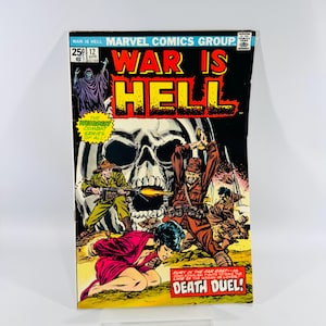May include: A vintage comic book titled "War is Hell" with a skull and soldiers on the cover. The cover features the text "War is Hell" in red and yellow, with the Marvel Comics Group logo. The comic is issue number 12.