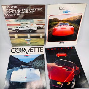 May include: Four vintage Corvette car brochures. One brochure reads "1953-1978 Chevrolet Presents The Silver Anniversary Corvette" with images of white and silver cars. Other brochures feature red and white Corvettes with the years 1975 and 1979.