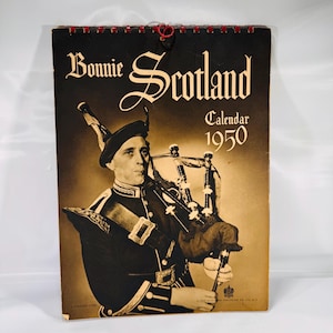 May include: Vintage 1950 "Bonnie Scotland" calendar. The cover features a sepia-toned image of a man in traditional Scottish attire playing bagpipes. The calendar title is in ornate white lettering against a black background.