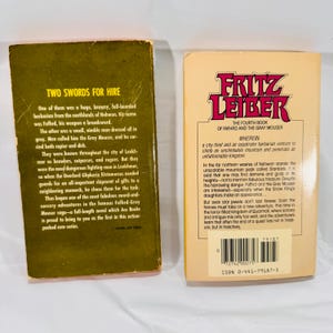 Back covers of both vintage fantasy paperbacks