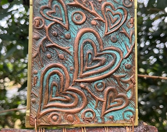 Móvil en cobre y latón