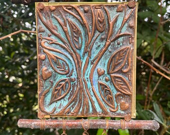 Móvil en cobre y latón