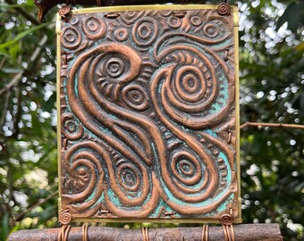 Móvil en cobre y latón