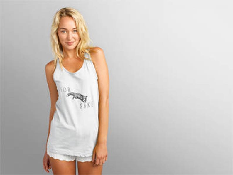 May include: White tank top with a black and white graphic of a fox with the text "for fox sake".