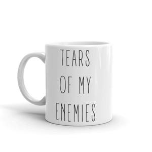 May include: White ceramic coffee mug with black text that reads "Tears of my enemies".