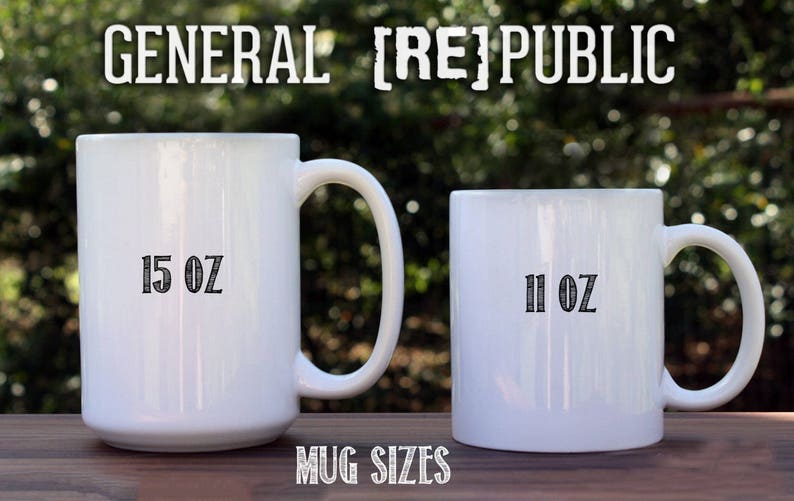 May include: Two white ceramic mugs with black text. The larger mug is 15 oz and the smaller mug is 11 oz. The text "GENERAL [RE]PUBLIC" is at the top of the image.