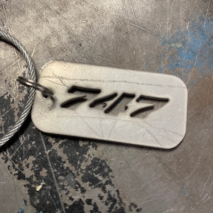Former Qantas Boeing 747-400 VH-OJM key chains.
