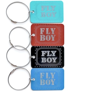 FLY BOY Aluminum luggage tag with Boeing aircraft window design.