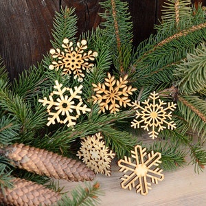Snowflakes (6 pcs.) - laser cut-out wooden snowflakes are ready to fall on your christmas tree, to make any place at your home more festive