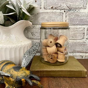 Vintage Glass Jar with Thread Spools: Commercial Paste Co. Enamel Lid