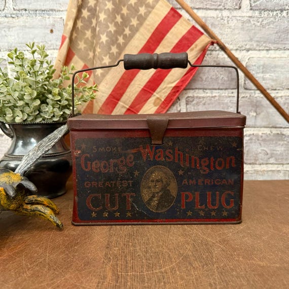 george washington tobacco can This is a vintage Cut Plug tin manufactured by the R.J. Reynolds Tobacco Company.It is a cylindrical steel container featuring patriotic red, white, and blue colors with an image Antique George Washington Tobacco Tin