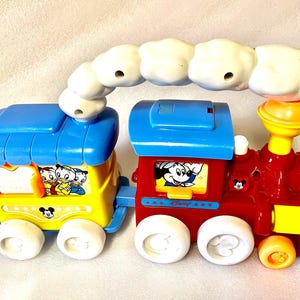 Vintage Disney Toy Train Mickey Mouse Donald Duck Push and pull activity Toy 32 cm Steam Engine two passenger carriages carrying Disney folk