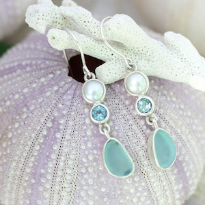 Aqua Sea glass earring showcasing blue topaz & pearl