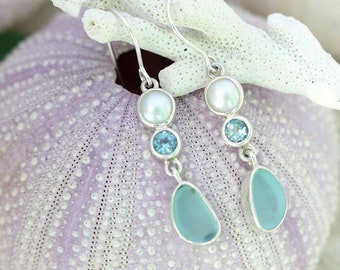 Aqua Sea glass earring showcasing blue topaz & pearl