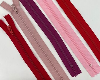 Assortment of Plain Zippers in shades of pink and red