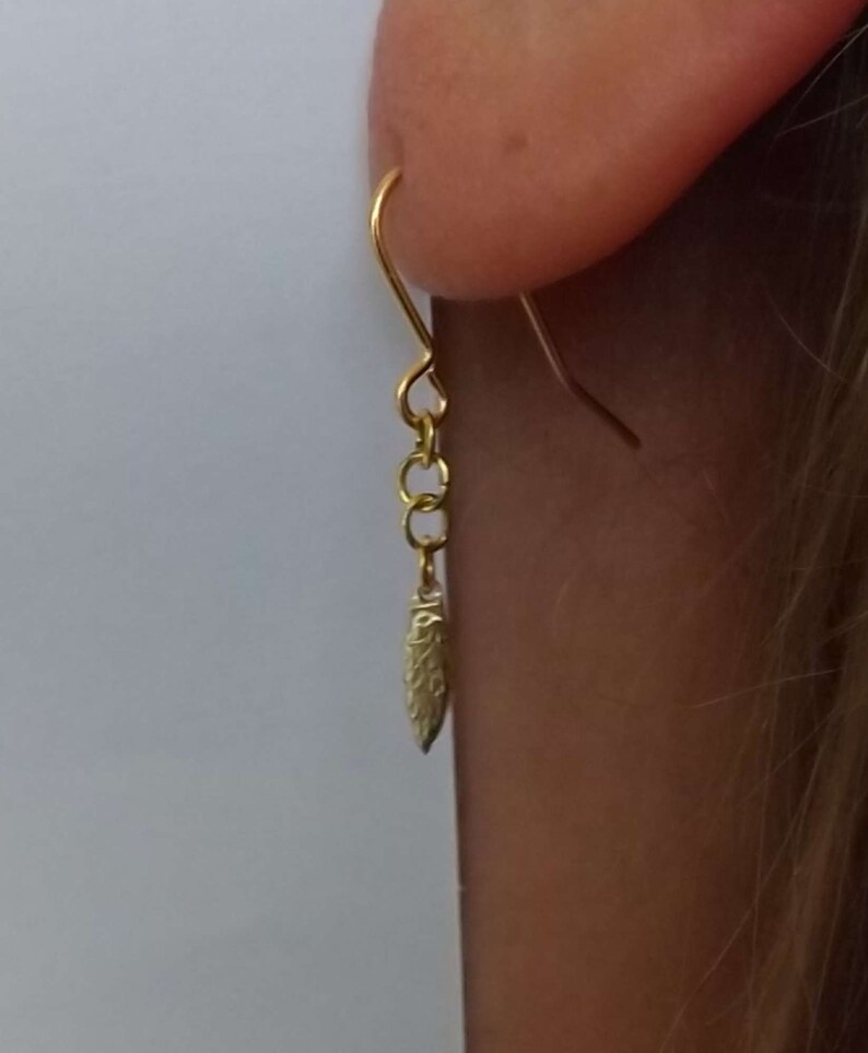 Drop earrings of /'leaf-shaped tool/' from a Polish 2 zlote coin dated 2012 commemorating the Krzemionki archaeological site in Poland