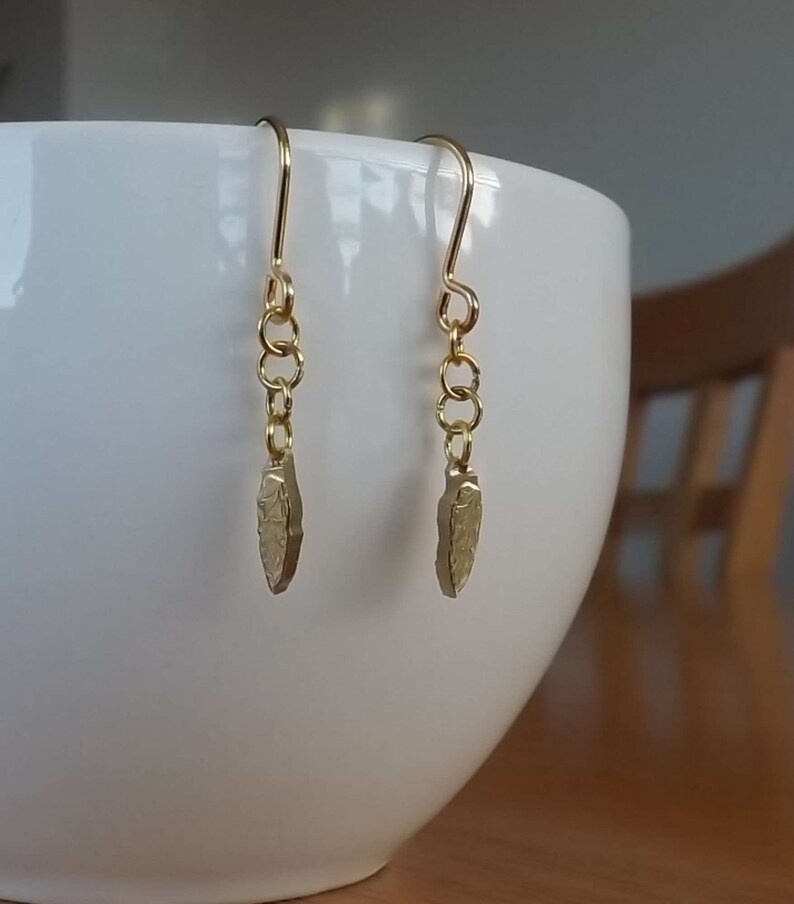 Drop earrings of /'leaf-shaped tool/' from a Polish 2 zlote coin dated 2012 commemorating the Krzemionki archaeological site in Poland