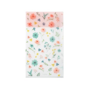 May include: Clear plastic folder with a floral pattern. The folder has a pink flap with a smaller floral pattern.