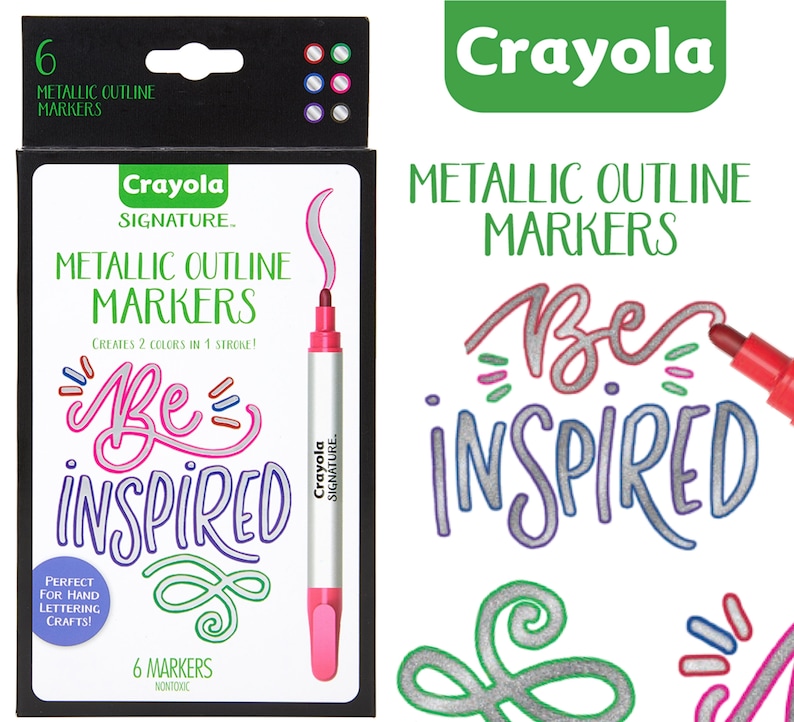 May include: A box of six Crayola Signature Metallic Outline Markers. The box is black with a white background and features a pink and silver marker with the text "Be Inspired" in silver and pink. The text "Crayola Signature" is also on the box. The box is surrounded by a white background.