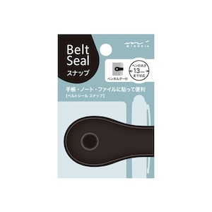 May include: Black belt seal snap with a pen holder. The packaging shows the seal attached to a notebook and a pen. The text on the packaging reads "Belt Seal Snap" and "Pen holder included".