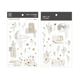 May include: Two sheets of floral print-on stickers with a moon, flowers, and handwritten text. The stickers are on a white background with a gray border.