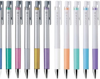 May include: Twelve silver and white pens with colorful accents. The pens are labeled "Juice up 04".