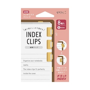 May include: A package of Midori Index Clips, featuring eight small, gold-colored clips. The packaging is white and pink, with Japanese text and English phrases like "INDEX CLIPS" and "Organize your notebooks neatly."