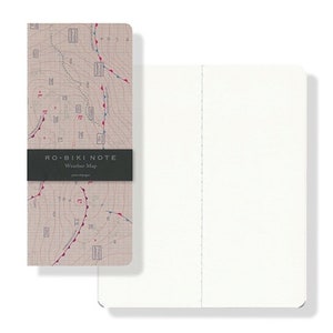 May include: A closed notebook with a weather map design on the front cover. The cover is beige with red and blue lines and markings. The text "RO-BIKI NOTE Weather Map" is printed on the front cover.