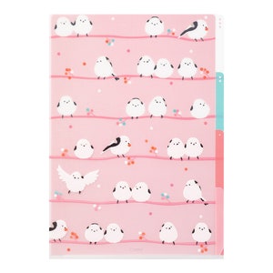 May include: A pink plastic expanding file folder with a design of white birds on branches. The folder has five tabs with different colors.