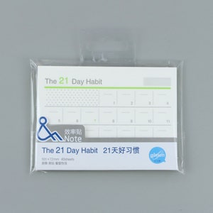 May include: A white notepad with a green and black title "The 21 Day Habit" and a grid of 21 squares. The notepad is packaged in a clear plastic bag with a hanging hole. The notepad is 101 mm by 72 mm and has 40 sheets.