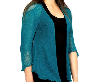 May include: Teal blue open-front cardigan with a loose fit and a scalloped hem.