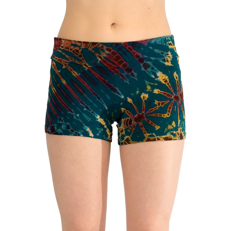 May include: Teal, red, and yellow tie-dye print women's athletic shorts.